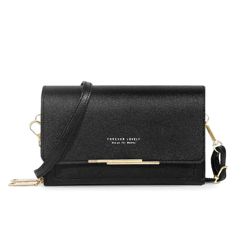 Sac à main CASSIE en cuir synthétique noir, bandoulière ajustable, avec rabat, compartiments et poches pour organiser vos essentiels avec style et praticité.