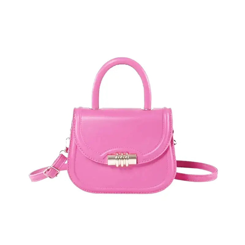 Petit sac à main rigide ELISA en bandoulière rose, design compact et élégant, idéal pour transporter téléphone, porte-cartes et clés avec style, cuir vegan et finition haut de gamme.