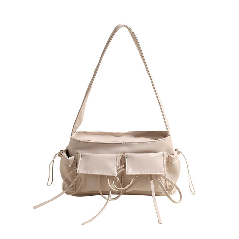 Sac à main Fiona en cuir vernis beige avec bandoulière, spacieux et raffiné, idéal pour ordinateur, cahiers et essentiels du quotidien.