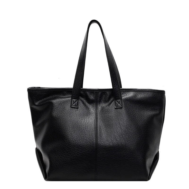 Sac à main KIM en cuir synthétique noir,  moderne et pratique, grand sac tote bag avec intérieur spacieux et finitions soignées, parfait pour le quotidien et le travail.