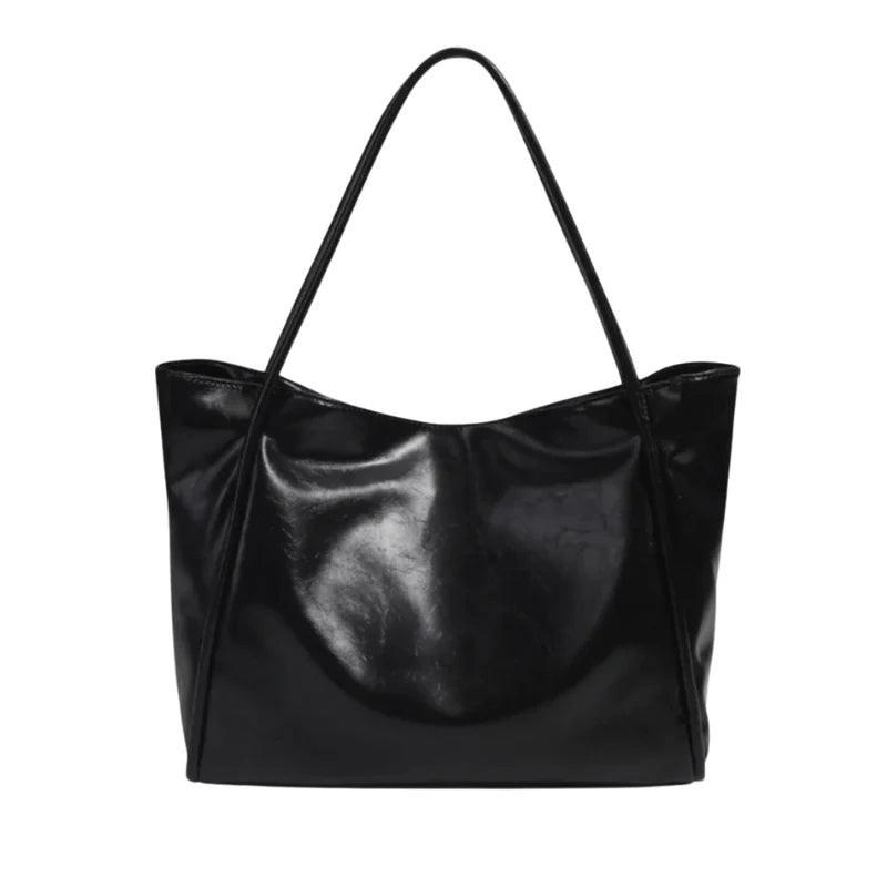 Sac à main LORIA en cuir synthétique NOIR, moderne et chic, avec bandoulière ajustable, intérieur spacieux et compartiments organisés, parfait pour le quotidien et les sorties.