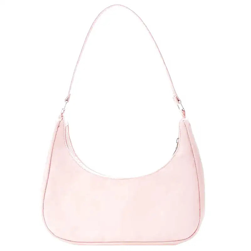 Petit sac à main MELIA en cuir vegan souple rose, format compact avec design chic et minimaliste, idéal pour une sortie élégante.