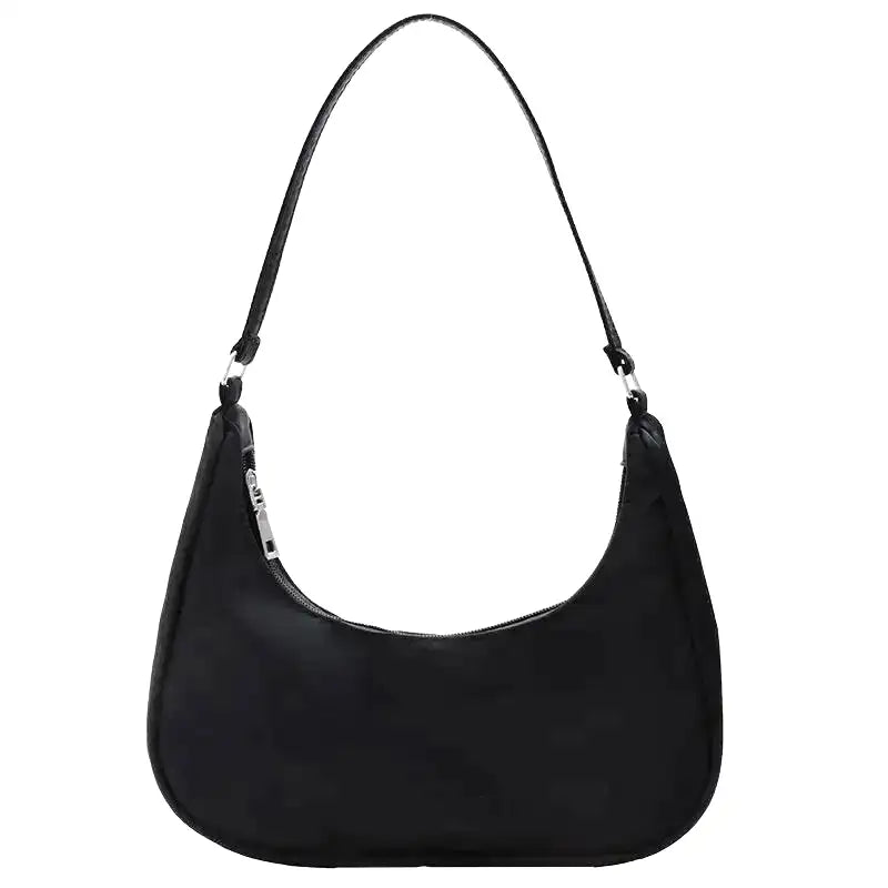 Petit sac à main MELIA en cuir vegan souple noir, format compact avec design chic et minimaliste, idéal pour une sortie élégante.