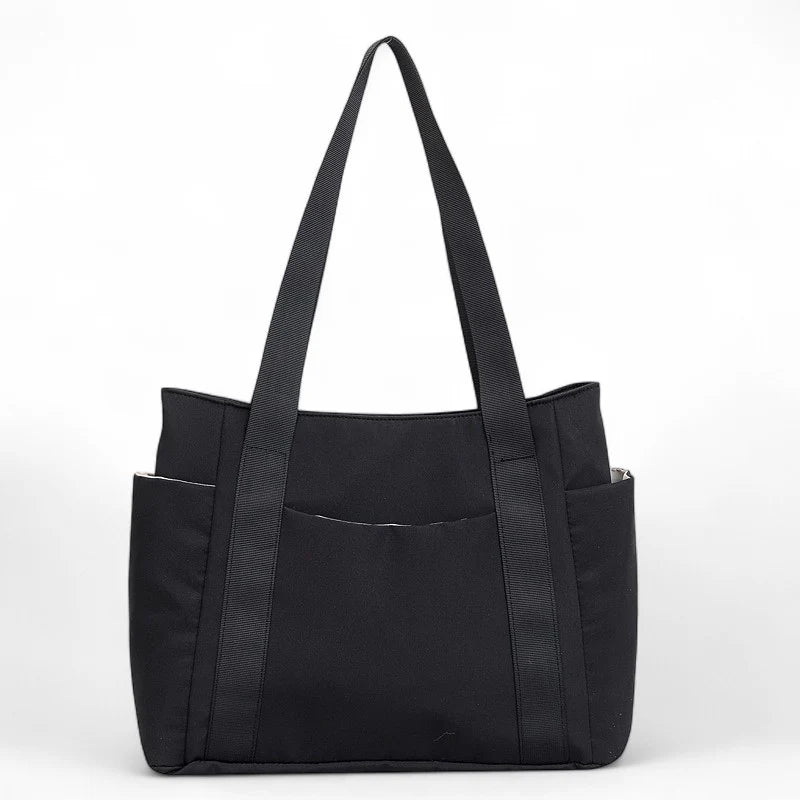 Grand sac cabas en tissu noir Neria, spacieux et pratique pour travail, cours et sorties.