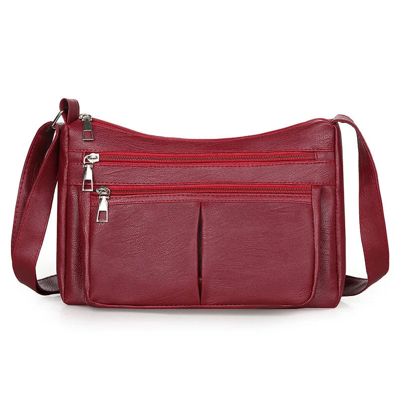 Sac à main Rita en cuir rouge multipoches avec bandoulière, spacieux et structuré, parfait pour ordinateur, cahiers et accessoires essentiels du quotidien.
