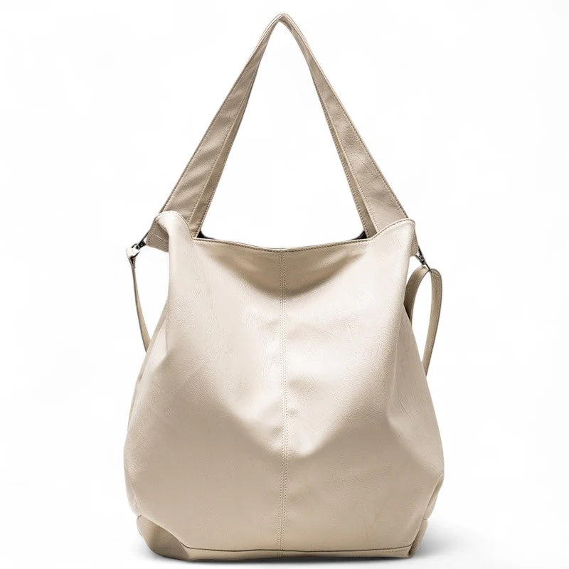 Sac à main SAVANNAH en cuir souple vegan blanc, grand format avec bandoulière réglable, parfait pour transporter ordinateur, dossiers et essentiels avec élégance et confort au quotidien.