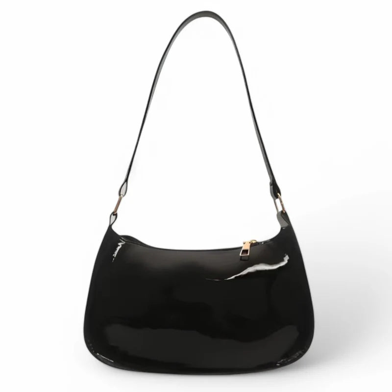 Sac à main SYA petit format vernis noir, design raffiné et lumineux, idéal pour transporter vos essentiels avec style lors de vos sorties