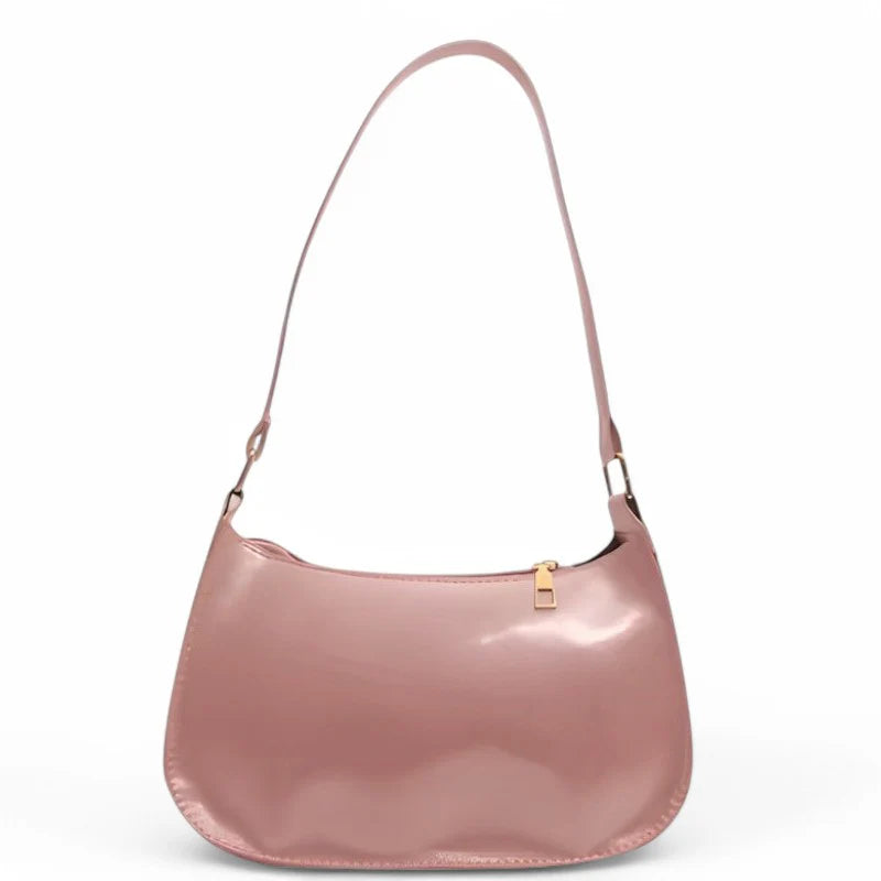 Sac à main SYA petit format vernis rose, design raffiné et lumineux, idéal pour transporter vos essentiels avec style lors de vos sorties