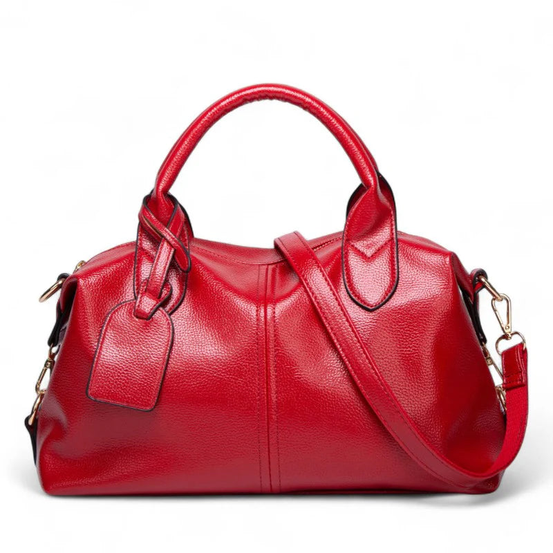 Sac à main bandoulière Yaelle en cuir rouge texturé, élégant et pratique pour étudiantes et jeunes femmes, avec bandoulière ajustable, design chic et compartiments organisés pour transporter cahiers, ordinateur et accessoires du quotidien.